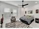 Bright bedroom with a king-size bed and zebra-striped comforter at 705 Pinckney Dr, Apollo Beach, FL 33572