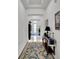 Bright and spacious entryway with elegant flooring and a console table at 705 Pinckney Dr, Apollo Beach, FL 33572