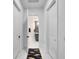 Clean hallway with access to multiple rooms at 705 Pinckney Dr, Apollo Beach, FL 33572