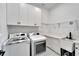 Laundry room with washer, dryer, and extra counter space at 705 Pinckney Dr, Apollo Beach, FL 33572
