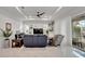 Relaxing living room featuring comfortable seating and access to a balcony at 705 Pinckney Dr, Apollo Beach, FL 33572