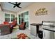 Outdoor patio with seating, grill, and mini-fridge at 705 Pinckney Dr, Apollo Beach, FL 33572