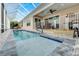 Inviting, refreshing pool with a screened enclosure at 705 Pinckney Dr, Apollo Beach, FL 33572