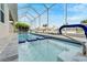 Stunning pool with seating and screened enclosure at 705 Pinckney Dr, Apollo Beach, FL 33572
