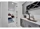 Stylish wet bar with wine rack and mini-fridge at 705 Pinckney Dr, Apollo Beach, FL 33572
