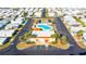 Aerial view of community showing building, pool, and parking at 7050 El Matador St, Zephyrhills, FL 33541