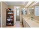 Clean bathroom with double vanity and additional storage at 7050 El Matador St, Zephyrhills, FL 33541