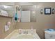 Guest bathroom with a vanity and toilet at 7050 El Matador St, Zephyrhills, FL 33541