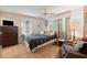 Comfortable bedroom with a queen-size bed and ample closet space at 7050 El Matador St, Zephyrhills, FL 33541