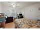 Bright bedroom with a double bed and a home office setup at 7050 El Matador St, Zephyrhills, FL 33541