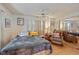 Spacious bedroom with a queen-size bed and a relaxing sitting area at 7050 El Matador St, Zephyrhills, FL 33541