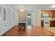 Eat-in kitchen with wood flooring and built-in hutch at 7050 El Matador St, Zephyrhills, FL 33541