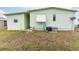 Side view of the mobile home, showing AC unit at 7050 El Matador St, Zephyrhills, FL 33541