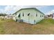 Side view of the mobile home, showing AC unit at 7050 El Matador St, Zephyrhills, FL 33541