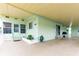 Side view of a manufactured home with covered patio at 7050 El Matador St, Zephyrhills, FL 33541