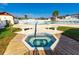 Community hot tub with wooden deck at 7050 El Matador St, Zephyrhills, FL 33541