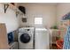Laundry room with washer, dryer, and utility sink at 7050 El Matador St, Zephyrhills, FL 33541