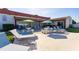 Spacious patio with lounge chairs and tables at 7050 El Matador St, Zephyrhills, FL 33541