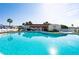Large community pool with patio and building at 7050 El Matador St, Zephyrhills, FL 33541