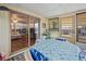 Relaxing screened porch with table and chairs, offering additional outdoor living space at 7050 El Matador St, Zephyrhills, FL 33541