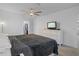 Main bedroom with dresser, TV, and ceiling fan at 8130 Merrimac Dr, Port Richey, FL 34668