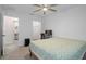 Bedroom with home office setup and ceiling fan at 8130 Merrimac Dr, Port Richey, FL 34668