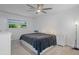 Spacious bedroom with ceiling fan and ample closet space at 8130 Merrimac Dr, Port Richey, FL 34668