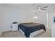 Bright bedroom with ceiling fan and large bed at 8130 Merrimac Dr, Port Richey, FL 34668