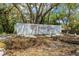 Timber Oaks community entrance sign and landscaping at 8130 Merrimac Dr, Port Richey, FL 34668