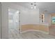Open dining area with access to the bathroom and living spaces at 8130 Merrimac Dr, Port Richey, FL 34668