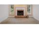 Brick fireplace is the focal point of this cozy living room at 8130 Merrimac Dr, Port Richey, FL 34668