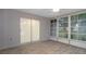 Bright Florida room with tile floor and sliding doors at 8130 Merrimac Dr, Port Richey, FL 34668