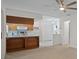 Updated kitchen with wood cabinetry, island, and modern appliances at 8130 Merrimac Dr, Port Richey, FL 34668