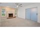 Living room featuring a brick fireplace and sliding glass doors at 8130 Merrimac Dr, Port Richey, FL 34668
