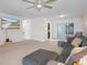 Bright living room with comfy seating, large TV, and sliding glass doors at 8130 Merrimac Dr, Port Richey, FL 34668
