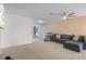 Spacious living room with comfy sectional sofa and large window at 8130 Merrimac Dr, Port Richey, FL 34668