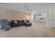 Living room with built in window seat and sectional sofa at 8130 Merrimac Dr, Port Richey, FL 34668