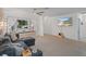 Living room with sectional sofa and large TV at 8130 Merrimac Dr, Port Richey, FL 34668