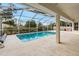 Relaxing screened-in pool and patio area with plenty of space for entertaining at 8382 Windridge Way, Weeki Wachee, FL 34613