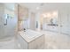 Spa-like bathroom with soaking tub and stone accents at 8459 Harvey Walden Dr, Plant City, FL 33565