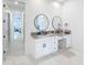 Elegant bathroom with double vanity and modern fixtures at 8459 Harvey Walden Dr, Plant City, FL 33565