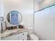 Clean bathroom with single vanity and shower/tub combo at 8459 Harvey Walden Dr, Plant City, FL 33565