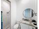 Clean bathroom with marble shower and vanity with granite countertop at 8459 Harvey Walden Dr, Plant City, FL 33565