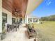 Spacious covered patio overlooking a large backyard at 8459 Harvey Walden Dr, Plant City, FL 33565