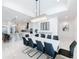 Modern dining room with a large table and statement chandelier at 8459 Harvey Walden Dr, Plant City, FL 33565