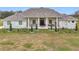 Stunning ranch home with stone accents and a large covered porch at 8459 Harvey Walden Dr, Plant City, FL 33565