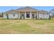 Beautiful two-story home with stone exterior and landscaping at 8459 Harvey Walden Dr, Plant City, FL 33565