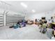 Spacious garage with ample storage space and high ceilings at 8459 Harvey Walden Dr, Plant City, FL 33565