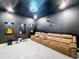 Home theater with projector, comfortable seating and recessed guitar displays at 8459 Harvey Walden Dr, Plant City, FL 33565