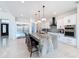 Modern kitchen with large island, stainless steel appliances, and white cabinets at 8459 Harvey Walden Dr, Plant City, FL 33565
